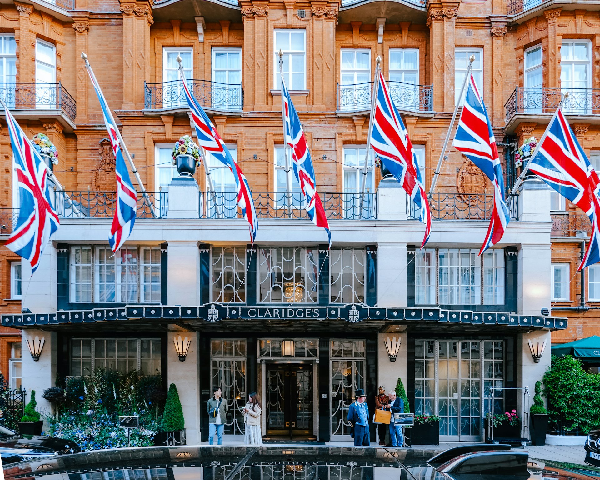 A Mayfair hotel facade hung with Union flags